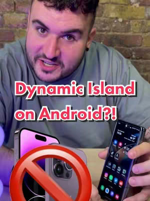 The cover image shows a man with a blurred background holding two phones, one with a forbidden sign superimposed over it. The hook text reads "Dynamic Island on Android?!" in a bold, pink font against a white backdrop. The man looks directly at the camera.