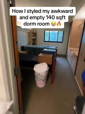 A dorm room interior is shown, viewed from a slightly open doorway. The room is narrow with cream-colored walls and a dark brown floor. Two partially visible beds, appear to be bunked, against the back wall with a window in the center. A trash can, filled with a white item, sits in the foreground. Text overlay indicates the video's subject.