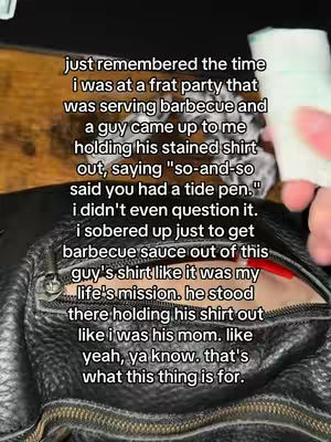 A close-up shot of a black purse handle, with text overlayed on the image. In the background, a wooden surface is partially visible. The image is well-lit, and the colors are natural with a focus on the purse and text.
