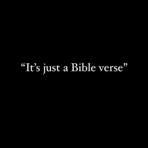 A stark image with a solid black background. Centered in the frame, white text states, "It's just a Bible verse." The text is in a clean, simple font.