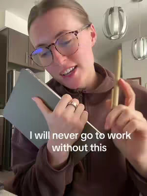 A woman with glasses holds a tablet and pen, with hook text and an indoor background.