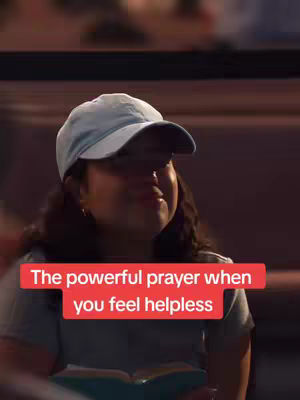 A person in a light blue hat and grey shirt sits angled toward the camera, with a red overlay on the bottom with a quote on it. The background is blurred and appears to be outside.