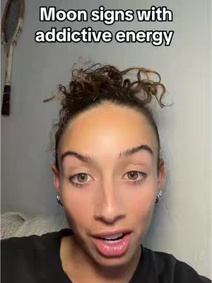 A close-up shot of a woman with a surprised expression. She has light skin, styled dark hair, and is wearing a dark top. Above her head is text on a light background. Partial tennis racket is visible on left side of the frame.