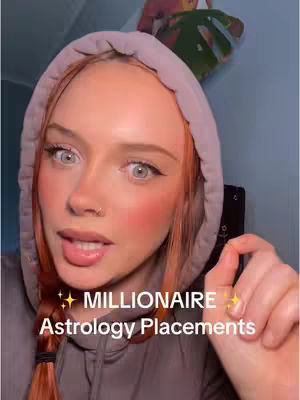 A woman with reddish hair and a grey hoodie looks toward the camera with a slightly opened mouth. Overlaying text indicates the video's topic. Overall a casual and friendly look.