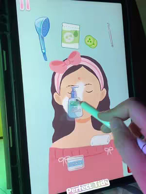 The cover image shows a screen of a tablet with a game interface. The game level is about skincare treatments. The interface includes cartoon-style items such as a shower head, what seems to be a jar, and slices of cucumber. The image features a cartoon character with closed eyes, with a face covered in white foam. The layout is simple, with light colors.