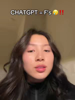 A selfie-style video cover with a young woman at the center. The background is a blurred interior. The text overlay reads "CHATGPT = F's 😭 !!" in a bold, white font above the woman's head.