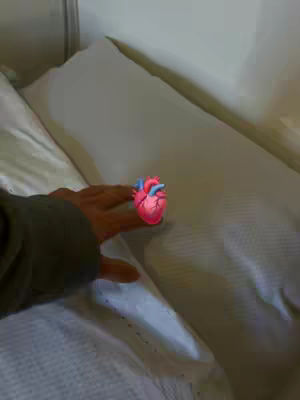 A hand reaching towards an animated heart on a bed, suggesting a focus on introspection and feelings aligned with the theme of responsibility.