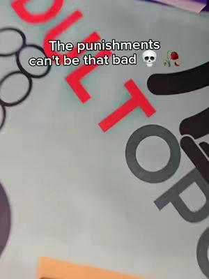 Close-up shot featuring a light grey background with large, bold, red letters and a black outlined grey circle. Overlaid text in black. The image has several emojis and a blurred effect.