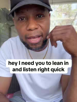 A man in a white shirt and a black cap looks directly at the camera. Text overlayed on image.