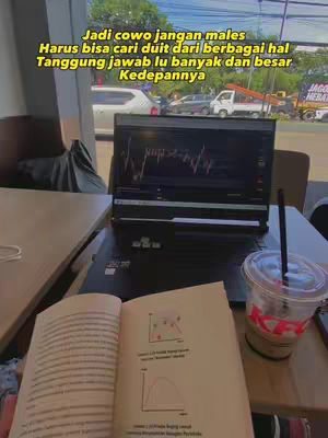 The image shows a laptop displaying a stock chart, a book with diagrams, and a drink on a table. The setting appears to be a cafe, with visible windows and partial views of the outside. Overlay text provides context.