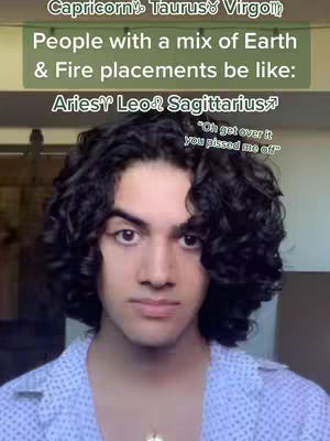 A selfie-style video cover image featuring a young man with dark curly hair, looking directly at the camera with a neutral expression. The top portion of the image contains text overlays in a green box listing zodiac signs, with additional text below. The man is wearing a light blue patterned shirt. The background is blurred, suggesting an indoor setting.
