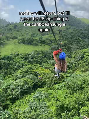 A woman ziplining through a lush green Caribbean jungle. The central figure, viewed from the back, wears a blue helmet, red gloves, and is secured with a harness. The foreground is filled with dense green foliage, while a hillside is visible in the background, with a caption overlayed across the top.