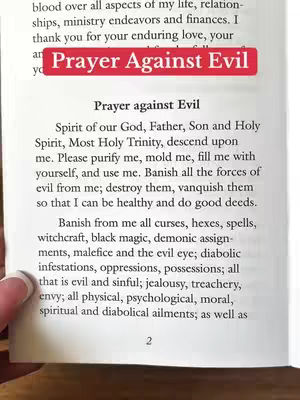 A partially visible page from a book is shown, the text is a prayer. The key elements are the text in the center of the view and the title overlayed.