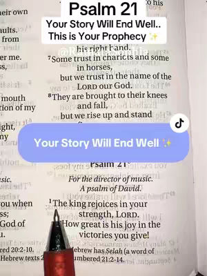 The image shows an open Bible with text overlayed on the page. The text is on a blue rounded rectangle with the title Psalm 21 printed at the top of the image. A pen is used to point to the bible verse.