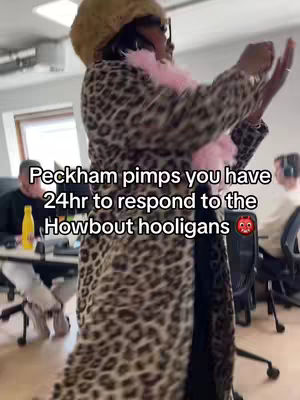 The cover image shows a person wearing a leopard-print coat, a pink boa, and a hat, standing in an office setting, gesturing with their hands. Text overlays the image.