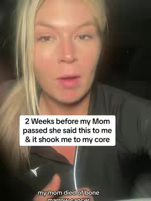 A close-up shot of a woman with blonde hair looking directly at the camera. She is wearing a dark-colored shirt. A text overlay is present with information about her mother's passing.