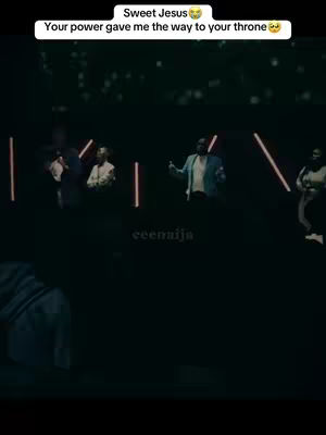The cover image shows a dark stage bathed in the glow of neon lights, with several people on stage. A text overlay adds inspirational verses.