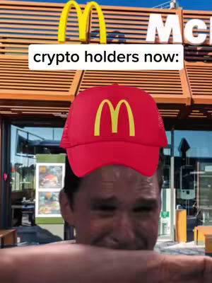 The cover image shows a man crying with a red McDonald's hat, a visual metaphor for a crypto holder's distress. The background shows the McDonald's storefront.