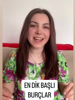 A woman with brown hair smiling at the camera with a floral shirt, with text "EN DIK BAŞLI BURÇLAR" placed on the bottom of the image.