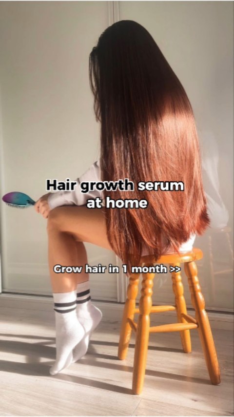 A woman is seated on a wooden stool, with long, flowing brown hair cascading down her back. She holds a brush in her hand.  The background is a bright, well-lit room, likely a home interior. Text overlays provide the video's title and a call to action.