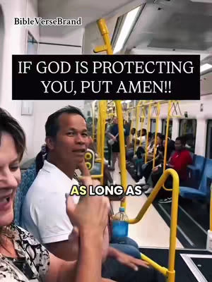 The image shows a scene on a train or bus. A man and a woman are in the foreground, the man is pointing his finger, and the woman is smiling and clapping with the man. In the background many people are seated. There is overlay text displayed.