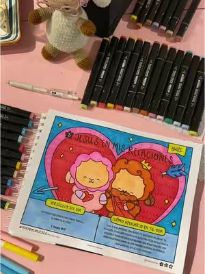The cover image shows a colorful, illustrated scene. A notebook is open on a table, with markers scattered around. The main focus is a drawing of two cartoon sheep characters within a heart-shaped frame, with text overlaid.