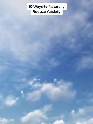 The cover image presents a bright blue sky with white clouds. In the center, there's a white rectangular box containing the text "10 Ways to Naturally Reduce Anxiety". The layout is simple and clean, with the text centrally positioned against the sky background.