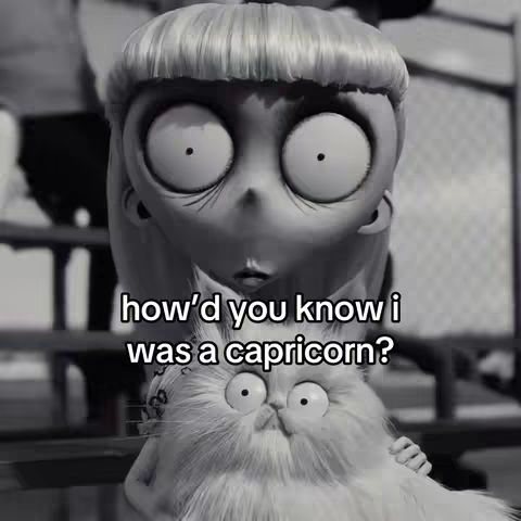 Black and white image featuring an animated character with large eyes and a cat. The text overlay asks 'How'd you know I was a Capricorn?'
