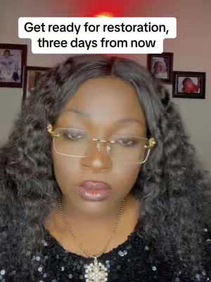 A woman with long, dark curly hair and gold-rimmed glasses gazes directly at the camera. The background includes framed pictures. Text is superimposed on top.