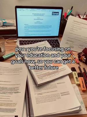 The cover image shows a workspace with a laptop, open books, and stationery on a wooden surface. The laptop screen displays a document, and the desk is scattered with papers, highlighters, and writing utensils, suggesting a study environment. The lighting is natural, and the composition is focused on study materials.