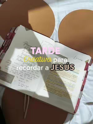 The cover image shows an open notebook on a white bed. The notebook is open to a page with handwritten notes, and a pink ink overlay adds the text, with some round brown structures providing visual interest in the background. The notebook has red page markers, further enhancing the image.