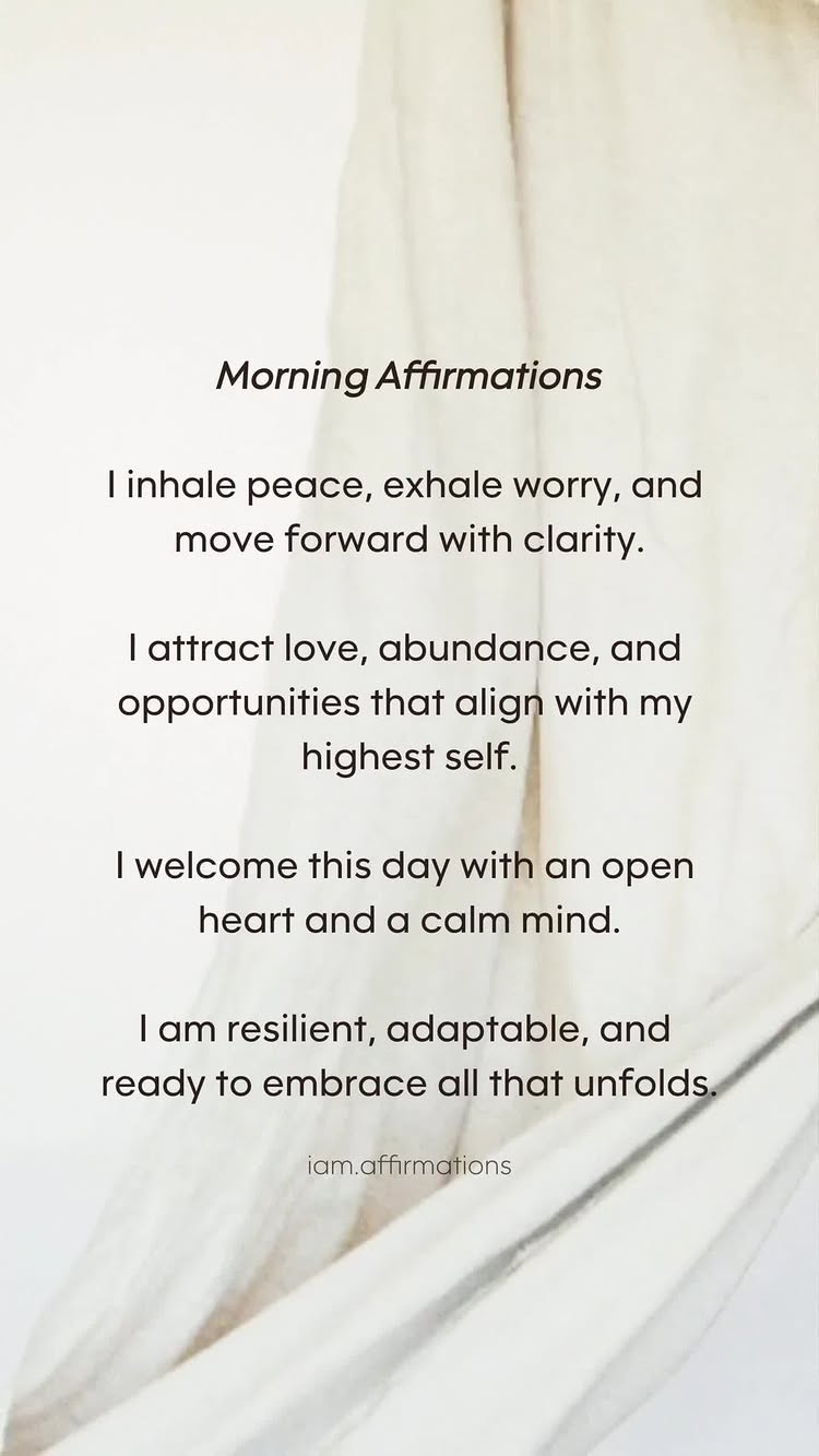 The image is a vertical composition with text on a soft, blurred background resembling draped fabric. The background is primarily white and cream, creating a sense of calm. The text is formatted in a clean, legible manner, with the title "Morning Affirmations" in a slightly bolder font.