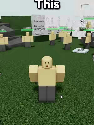 A Roblox game scene with blocky characters. In the foreground, a central Roblox character stands still, with arms at its side. The background shows other similar characters, some with user interface elements above them, set on a grassy ground. Above the scene, the word 'This' is displayed with a black outline.