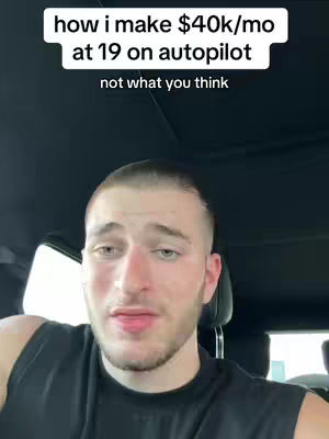 A selfie-style shot taken from inside a vehicle, featuring a young man. The man has short hair and is looking towards the camera. Text overlays are present above and below him. The overall setting appears to be daytime, and the lighting seems natural.