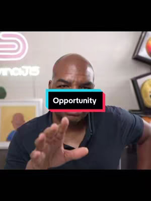 A man with a bald head wearing a dark shirt is gesturing with his hand towards the camera. A text overlay that says 'Opportunity' is centered on his face.