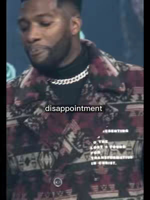 A man in a patterned coat and a chain necklace is the focus, with the word "disappointment" overlaid. Text on the coat identifies the theme of the video as based on Christian content and religious transformation.