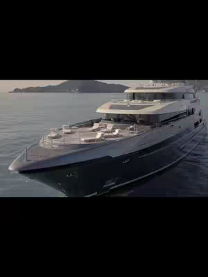 Still image of a large, modern yacht at sea, captured from a low angle. The yacht has a sleek, dark blue hull and a multi-level structure with white upper decks. Lounging areas are visible on the top deck. The sea is calm, reflecting the sky. The image composition is cinematic.