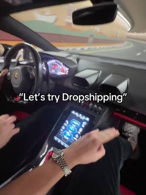 The cover image is taken from inside a car, likely a luxury vehicle like a Lamborghini, showing hands on the steering wheel and touchscreen controls. The text overlay says, "Let's try Dropshipping". The overall composition is dynamic with a clear focus on the interior.