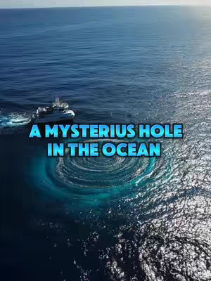 An aerial shot of the ocean with a ship sailing toward the center and text overlayed on the water. The sea is a gradient of blues, with a noticeable circular pattern of swirling water in the center, and the caption is placed over this area.