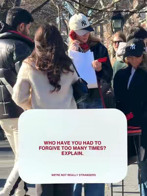 The cover image shows a group of people on a sunny day in an outdoor setting. A white box overlay in the bottom section features text, contrasting with the blurred background. The overall composition is candid with a focus on storytelling through text.