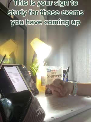 The image shows a student's desk with an iPad, a lamp, and what appears to be a hand writing on paper. A box of 'Clay Counters' is visible. The overall composition suggests a study environment.