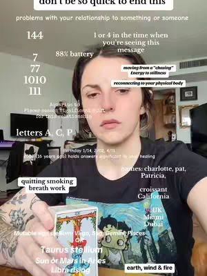 A person is in the center, looking toward the viewer and holding a tarot card. Text overlays include astrological references and information about the creator. The background is a room with furniture and a light source.