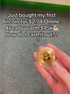 The image shows a hand holding a gold coin with a Bitcoin symbol. Text overlays on the image ask "How do I cash it out??" alongside of other informations and emojis.