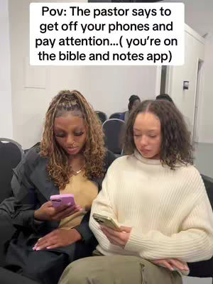 The cover image shows two young women seated side-by-side, each absorbed in their smartphones. Above them, text reads, "Pov: The pastor says to get off your phones and pay attention... (you're on the bible and notes app)." The women appear to be in a church setting, with rows of seats visible, suggesting a moment during a sermon or religious service. The lighting is soft, and the colors are natural, focusing attention on the women and the humorous text overlay.
