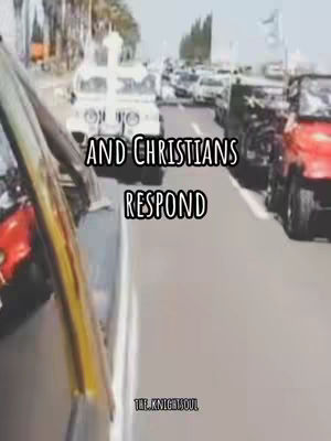 An image showing a car, a white car with a cross on top of it is in front. In the background, there are other cars on the right side of the image, indicating the parade-like nature of the event. The text overlay, "AND CHRISTIANS RESPOND"