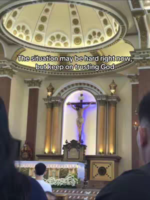 The cover image shows the interior of a church, focusing on the altar and crucifix. Above the altar is a domed ceiling. Text overlayed above the center reads, "The situation may be hard right now, but keep on trusting God".