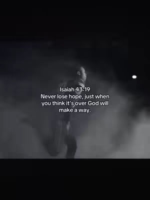 A grayscale image featuring a person running towards the viewer through a smokey or foggy environment. Text overlays provide a bible verse.