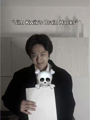 The image features a man in a blazer holding a white paper and a cartoon skull with crossbones, his arms outstretched. Above him is text overlayed onto the image.