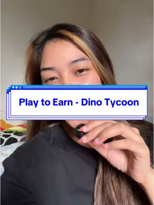 A person is shown from the chest up, with a light-colored wall in the background. The person is looking at the camera with a slight smile, and has a short microphone in front of the mouth. A rectangular overlay with the text 'Play to Earn - Dino Tycoon' is in front of the character.