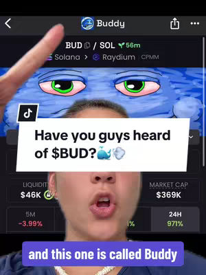 The cover image shows a young woman with brown hair and a blue top pointing towards the upper part of the screen, where a text overlay says 'Have you guys heard of $BUD?' The background has a screen that displays cryptocurrency data, the woman is looking at toward the camera with her mouth open.